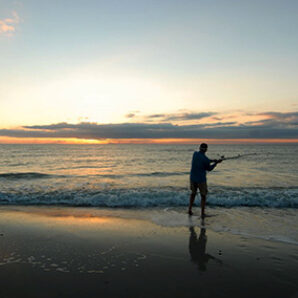 Fishing-from-the-shore-cape-san-blas Cape San Blas Vacation Rentals decorative image of person fishing on the beach