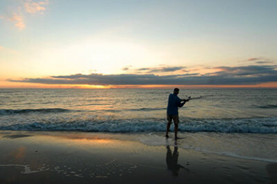 Cape San Blas Vacation Rentals decorative image of person fishing on the beach