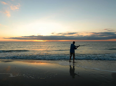 Cape San Blas Vacation Rentals decorative image of person fishing on the beach