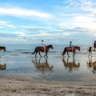 cape-san-blas-vacation-rentals-vrbo-dog-friendly-302 Cape San Blas Vacation Rentals decorative image of horseback riding on the beach